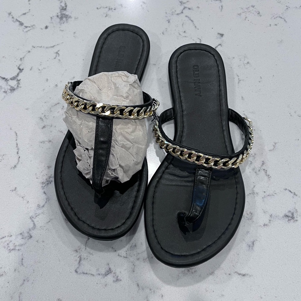 Faux-leather, t-strap, upper gold tone chain accent sandals